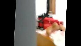 2 asian girls with pet ears kissing spitting licking face while standing in the sitting room