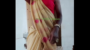 indian aunty striping her saree