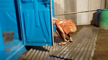 girl pissing on a car hood