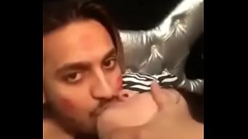 man licking and sucking women breast